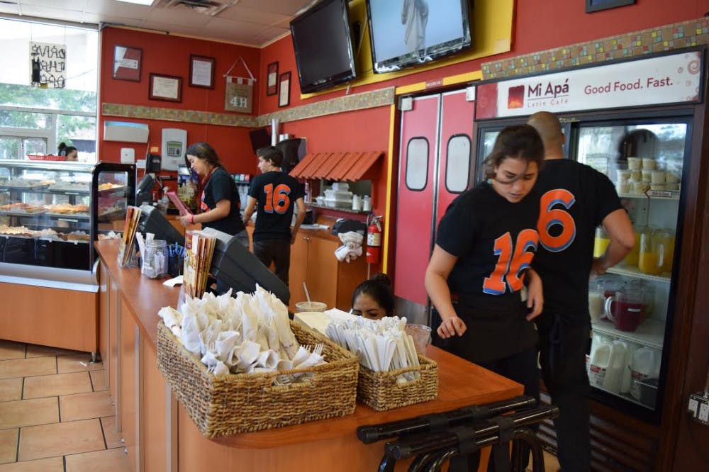 <p><span id="docs-internal-guid-0b50f934-d0e9-d93d-ac66-1c27ea674fc2"><span>Employees at Mi Apa Latin Cafe of Gainesville wear orange-and-blue number 16s on their shirts to honor the memory of Miami Marlins pitcher José Fernández, who died on Sept. 25 in a boating accident.</span></span></p>