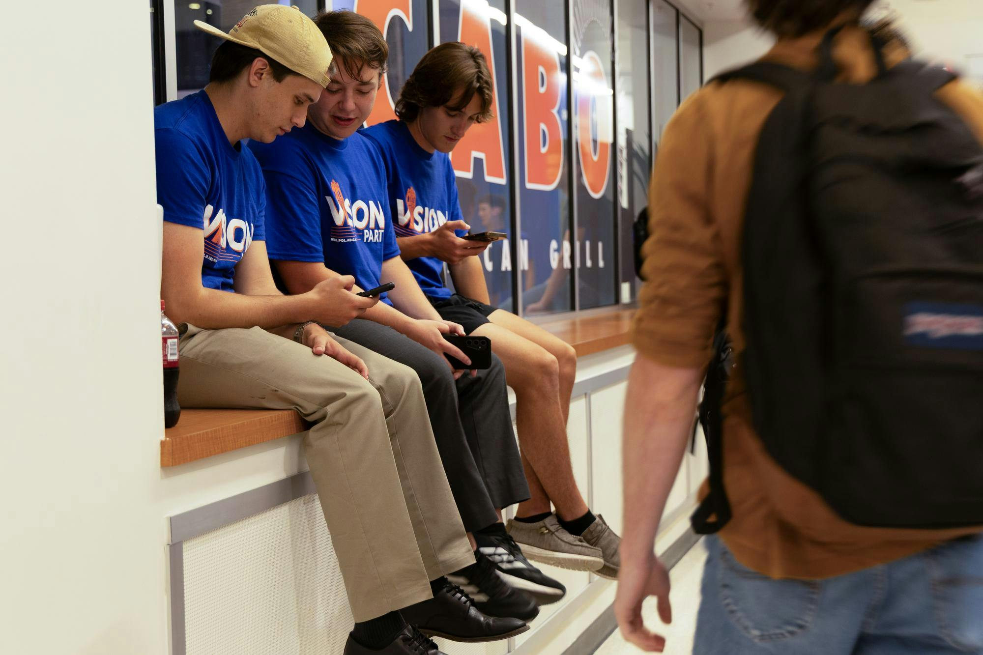 Members of Vision Party sit in front of Cabo Mexican Grill in the Reitz Union in anticipation of the student government election results, Wednesday, Sept. 30, 2026, in Gainesville, Fla.