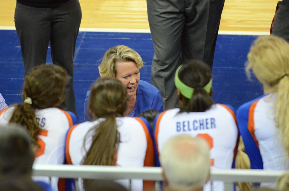 <p>UF coach Mary Wise talks to her team during a timeout in Florida's 3-0 win against Auburn.</p>