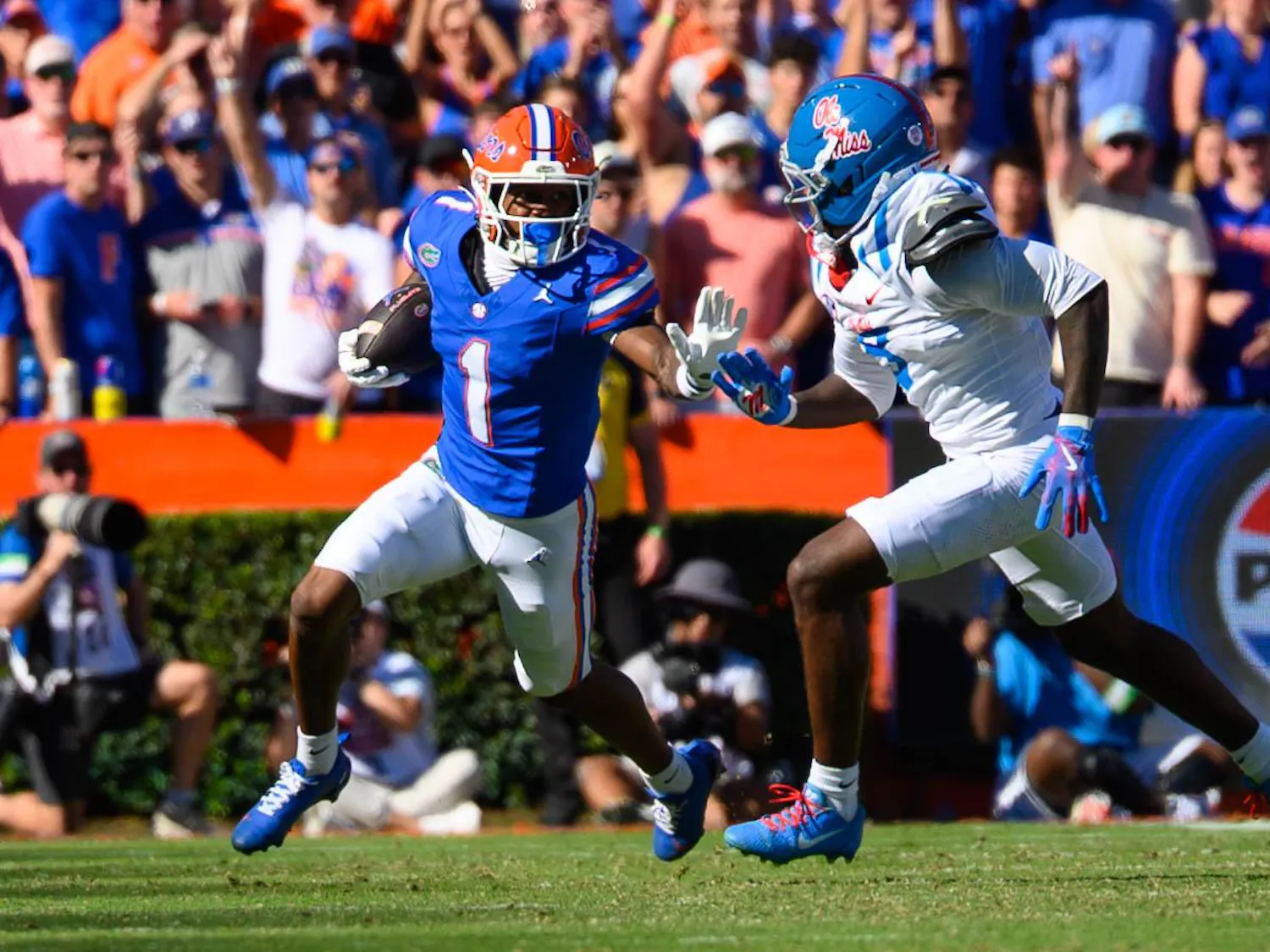 Florida wide receiver Vernell Brown III (1) escapes a defender during the first half of an NCAA college football game against Ole Miss, Saturday, Sept. 26, 2026, in Gainesville, Fla.