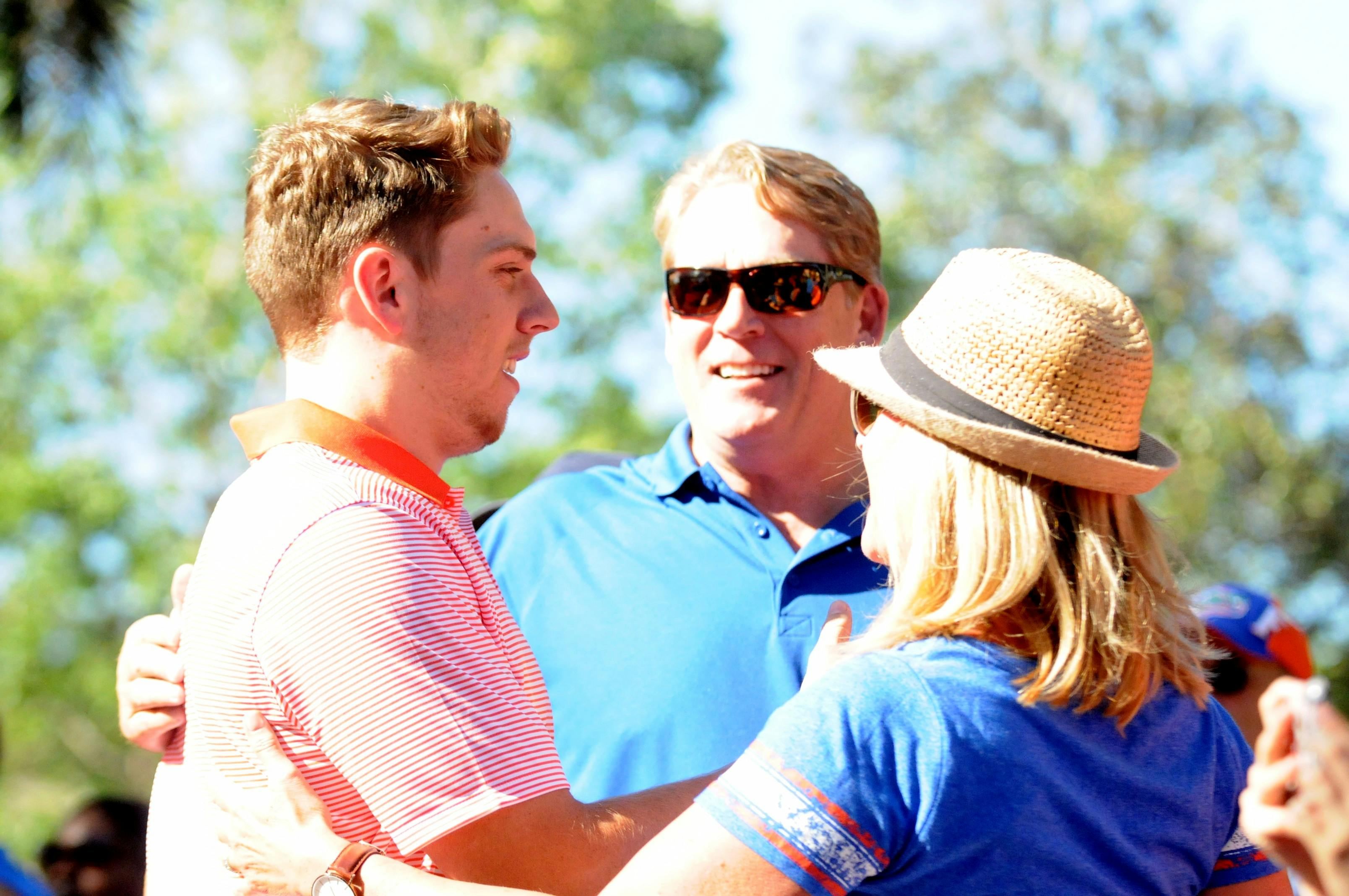 Quarterback Luke Del Rio (left) hugs his parents -- dad Jack Del Rio and mom Linda Del Rio -- during Gator Walk prior to the Orange &amp; Blue Debut on April 8, 2016, at Ben Hill Griffin Stadium.