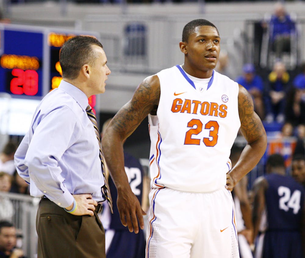 <p>UF coach Billy Donovan (left) said working with freshmen like Brad Beal (right) has been a rewarding part of the job and something that keeps him motivated after 18 years.</p>