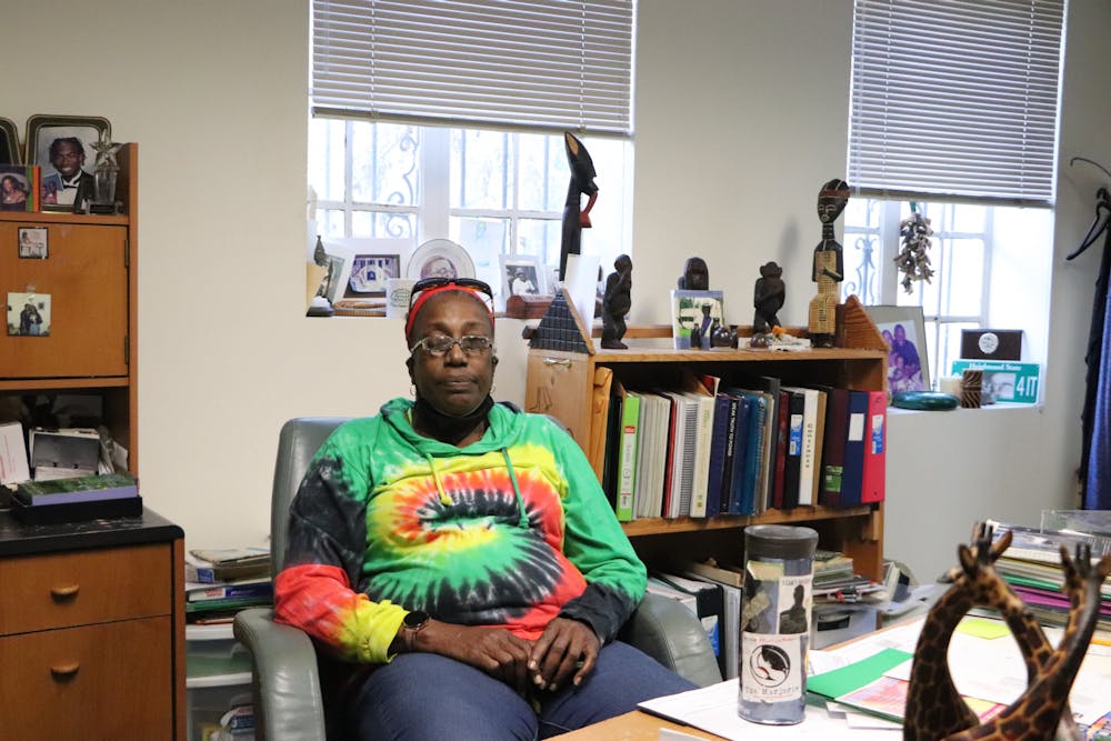 <p>NKwanda Jah sits in her office at Wilhelmina Johnson Center on Wednesday, Feb. 16, 2022. Jah runs an afterschool science program from her office.</p>
