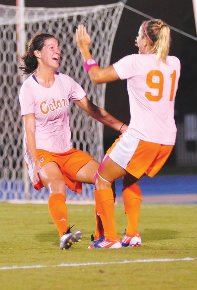 Senior Jo Dragotta (left) celebrates with junior Adriana Leon (right) after scoring a goal in Florida's 2-1 win against Missouri on Friday at James G. Pressly Stadium. Dragotta is tied for the team lead in goals with five.