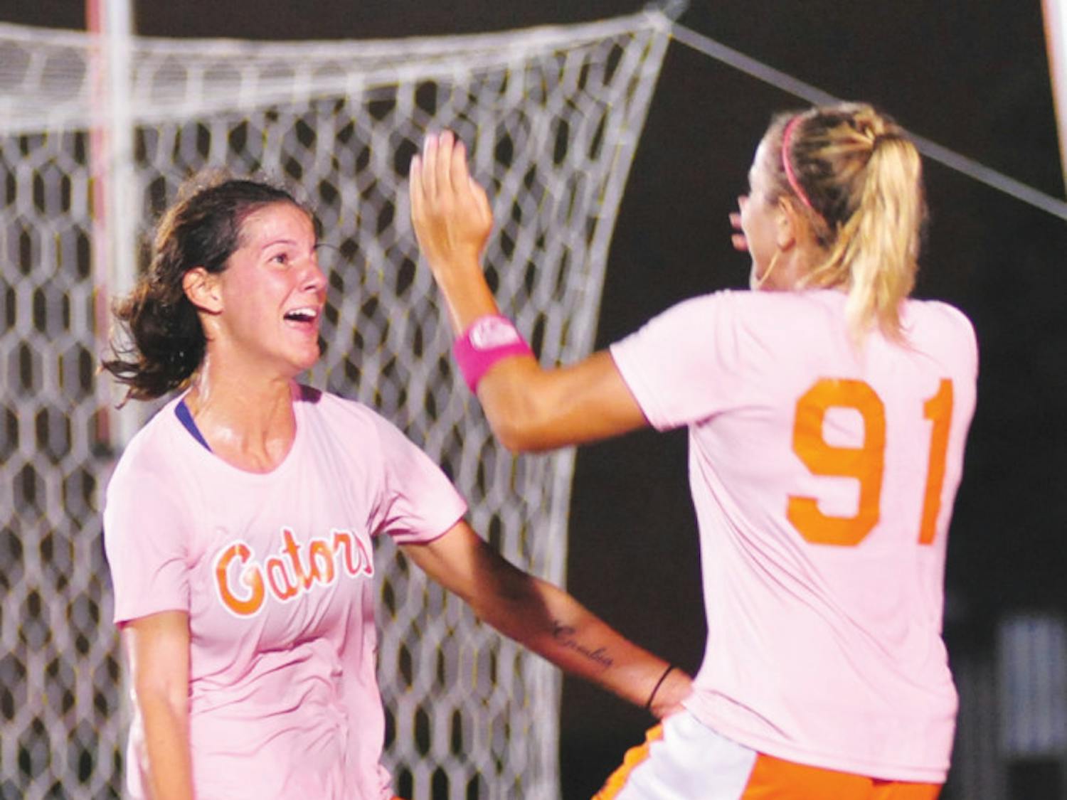 Senior Jo Dragotta (left) celebrates with junior Adriana Leon (right) after scoring a goal in Florida's 2-1 win against Missouri on Friday at James G. Pressly Stadium. Dragotta is tied for the team lead in goals with five.