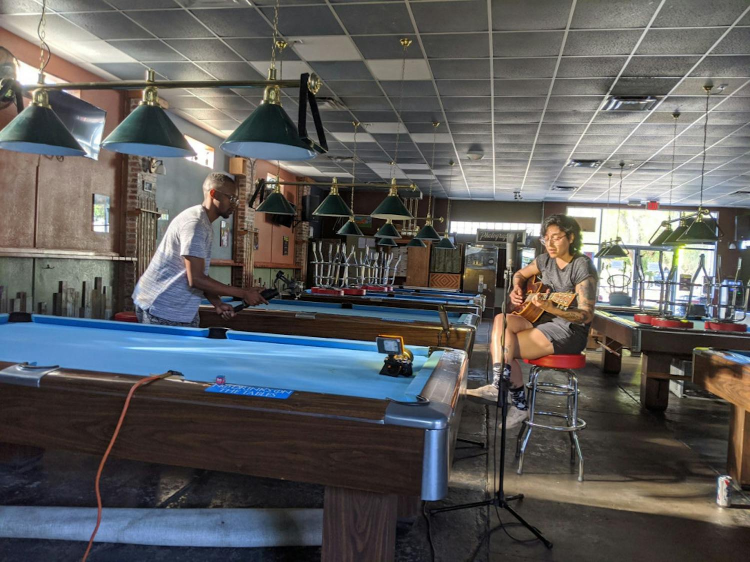 Katy Deitz performs in an empty Palomino Pool Hall. MusicGNV, a program of the non-profit organization Self Narrate, launched last month with a video series of local artists performing in their favorite locations, which have similarly been affected by COVID-19.