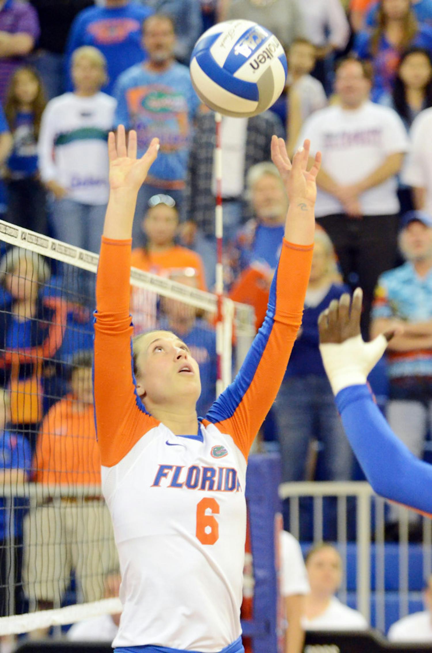 Mackenzie Dagostino sets the ball during Florida's 3-0 win against Alabama State during the first round of the NCAA Tournament on Friday in the O'Connell Center.
