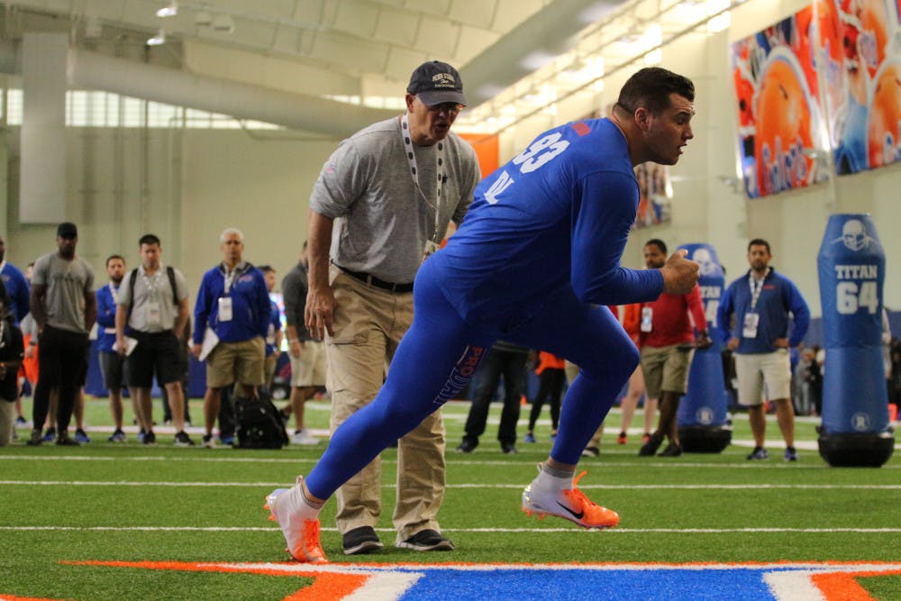 <p>Florida defensive lineman Taven Bryan gets instruction from Dallas Cowboys defensive coordinator Rob Marinelli during UF's pro day on Wednesday. </p>