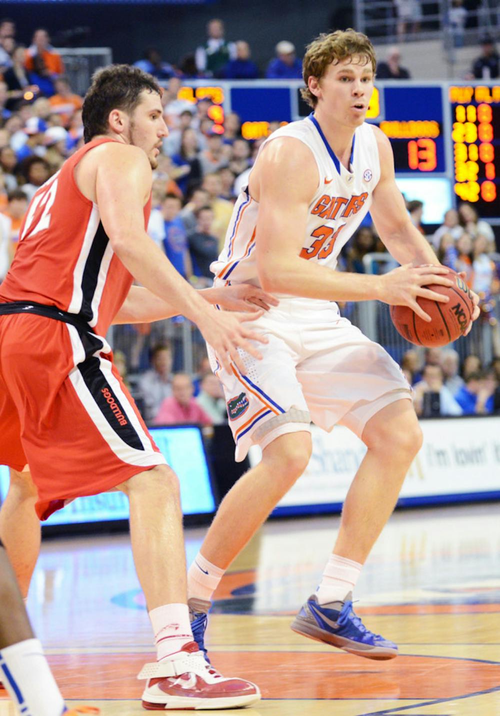 <p>Forward Erik Murphy passes the ball during Florida’s 77-44 win against Georgia on Jan. 9 in the O’Connell Center. Murphy scored 17 points in Florida's 61-57 loss at Kentucky on Saturday.</p>