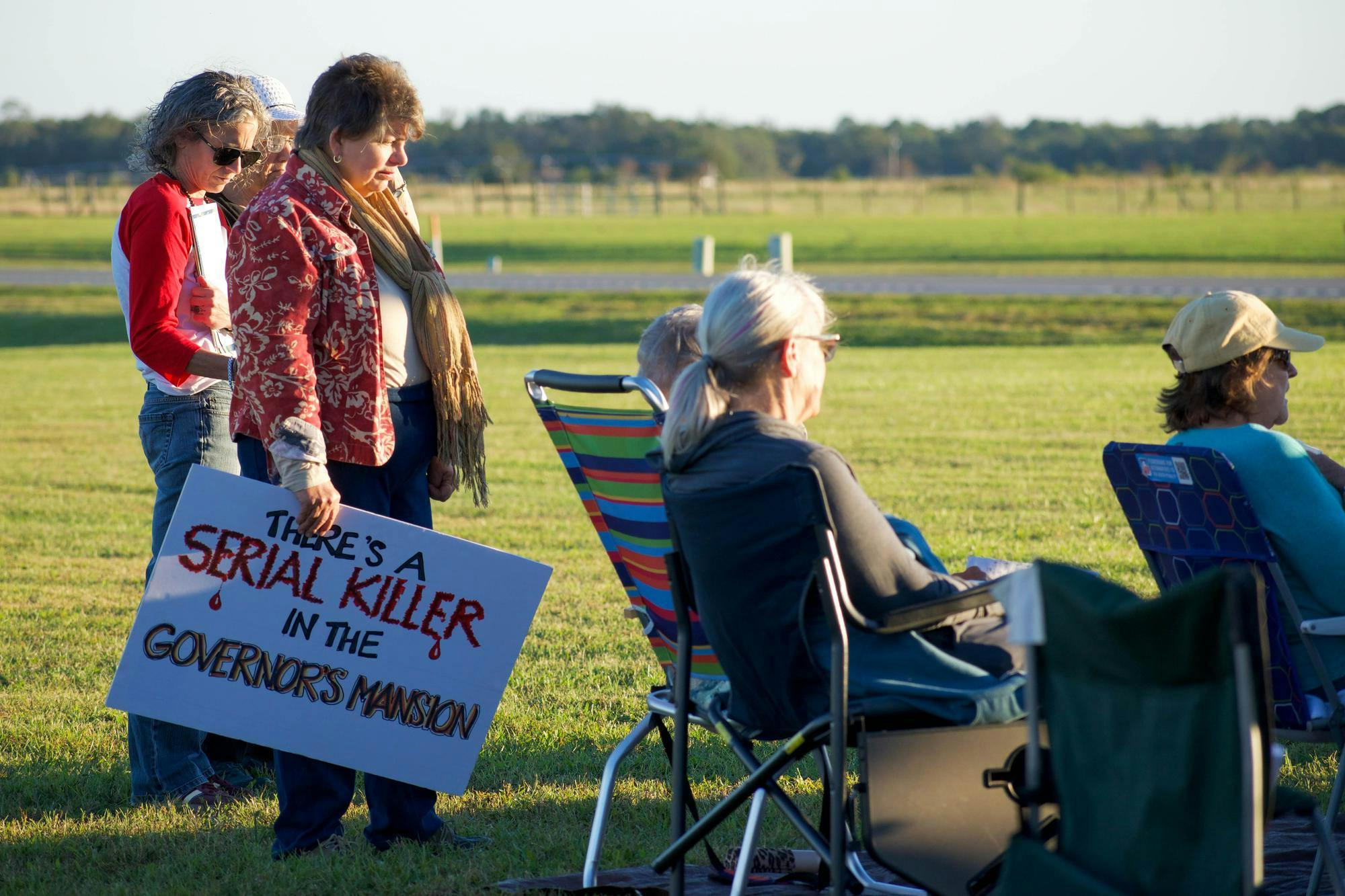 Protesters sing outside Florida State Prison, Tuesday, Oct. 20, 2026, in Raiford, Fla.