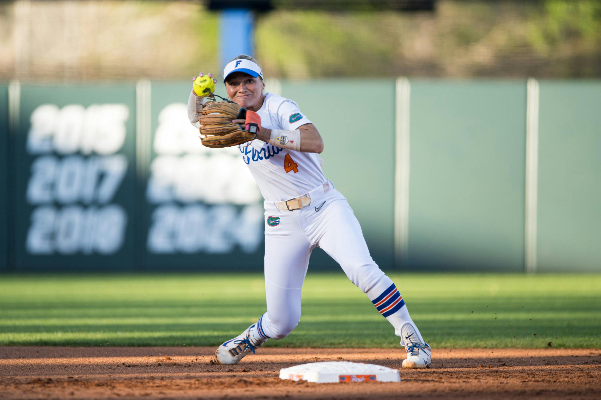 Florida Gators infielder Rylee Holtorf (4) throws the ball in a softball game against UCF in Gainesville, Fla., on Wednesday, March 12, 2025.