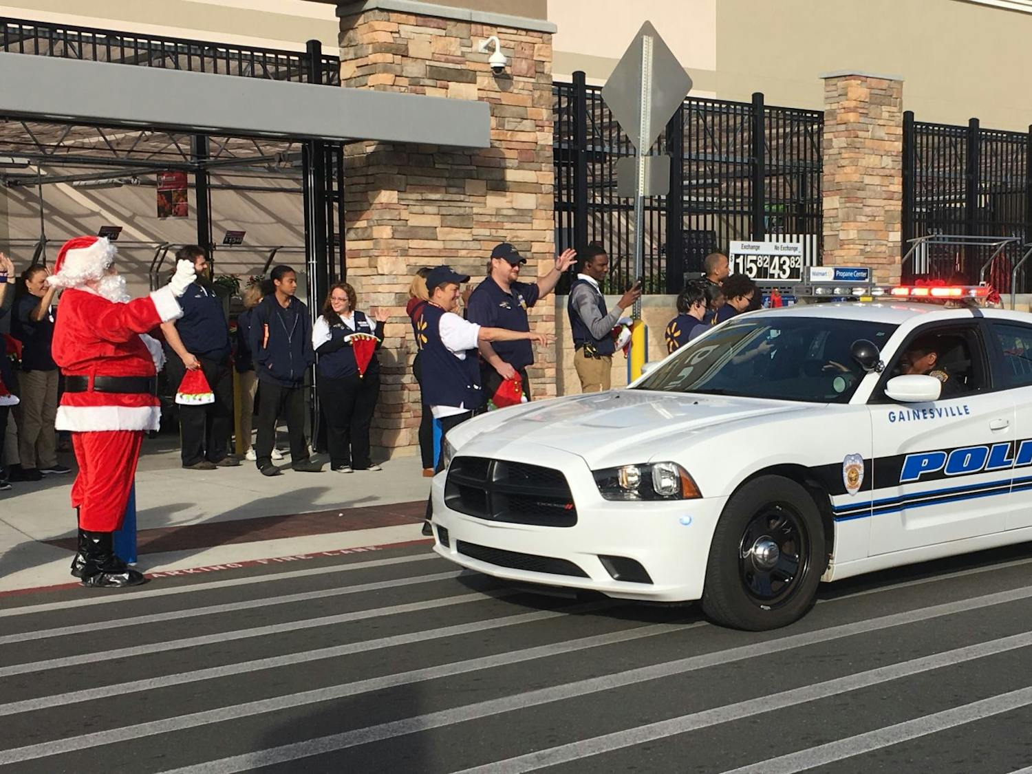 More than 20 Alachua County students arrived at Walmart in police cars. Santa along with an eager group of Walmart employees greeted them before they began shopping.&nbsp;