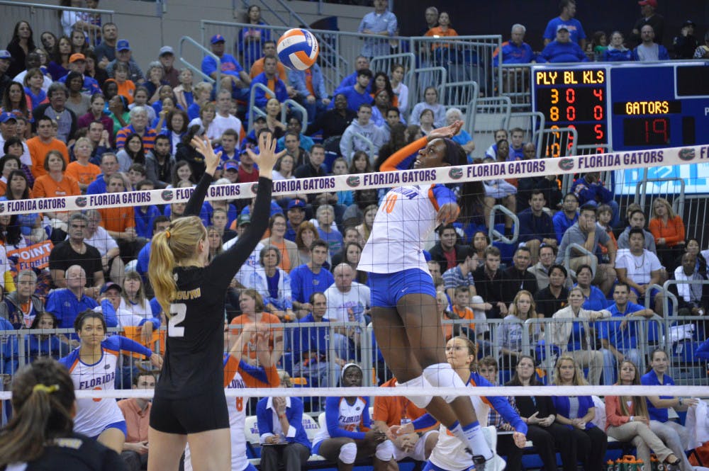 <p>Redshirt senior middle blocker Chloe Mann swings during the Gators' 3-0 loss to the Tigers on Nov. 15, 2013, in the O'Connell Center. Mann paced the Gators with a .506 hitting percentage in 2013 en route to becoming the NCAA career hitting percentage leader with her .476 clip.</p>