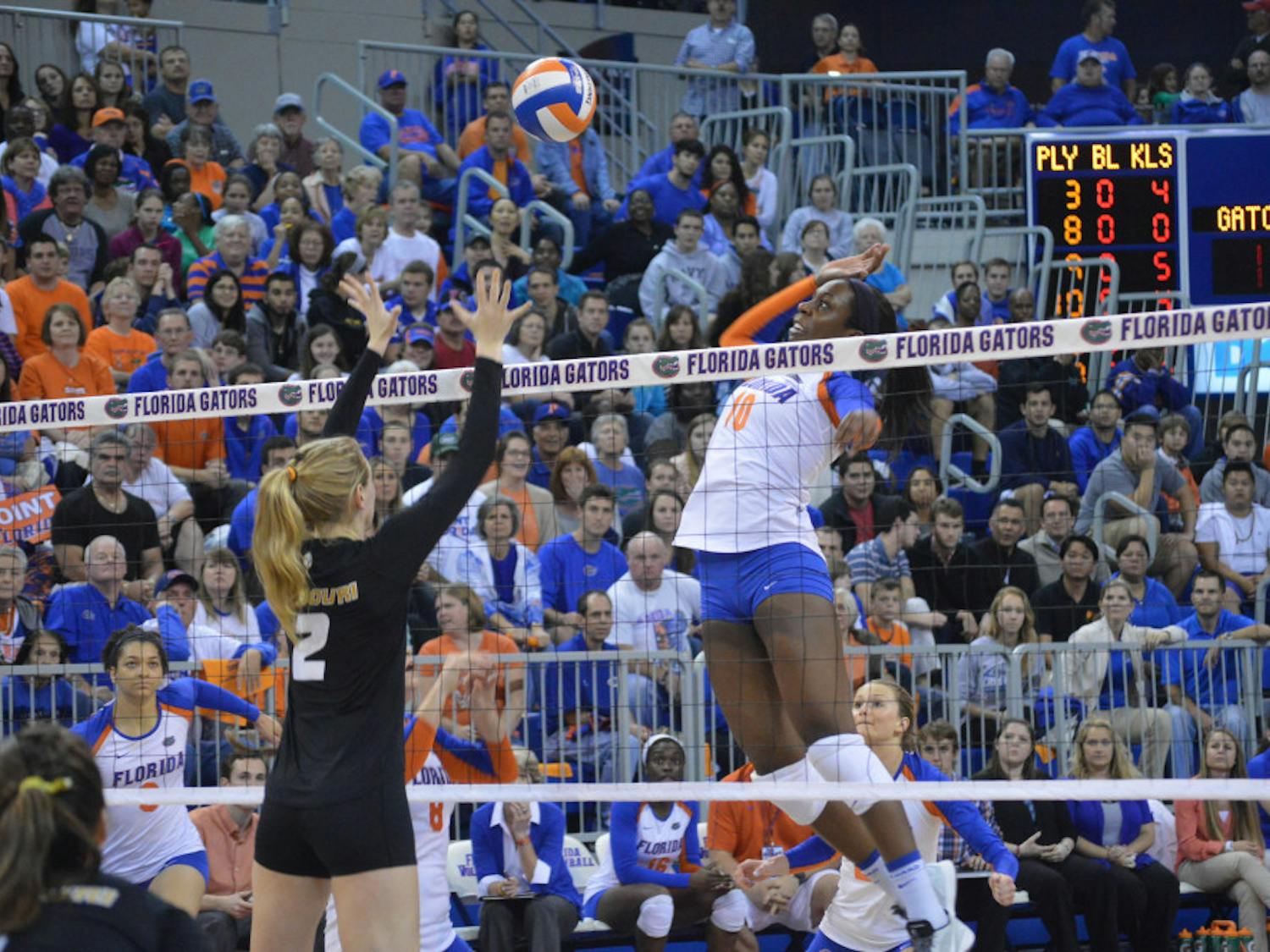 Redshirt senior middle blocker Chloe Mann swings during the Gators' 3-0 loss to the Tigers on Nov. 15, 2013, in the O'Connell Center. Mann paced the Gators with a .506 hitting percentage in 2013 en route to becoming the NCAA career hitting percentage leader with her .476 clip.
