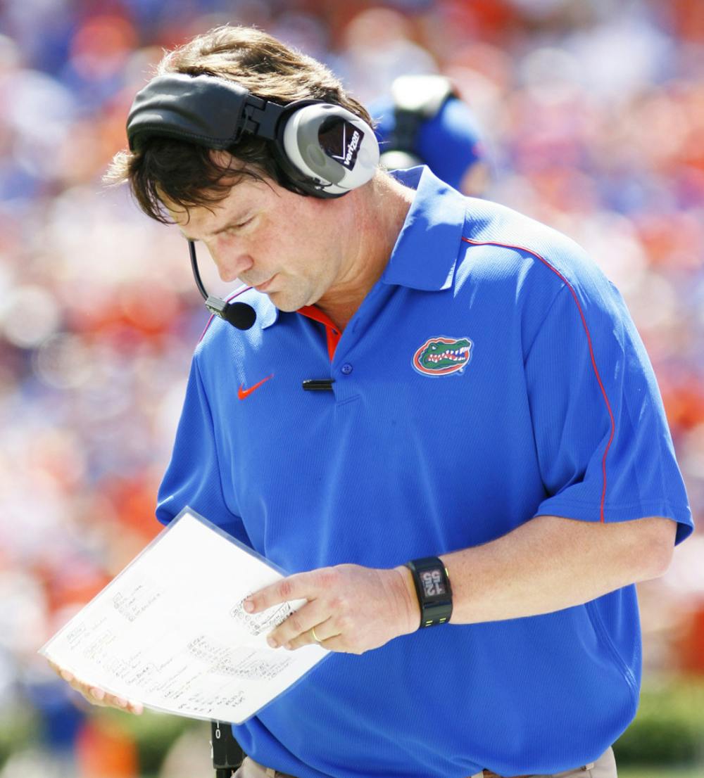 <p>Gators coach Will Muschamp looks over a chart against Kentucky on Saturday at Ben Hill Griffin Stadium. No. 11 Florida has the week off before taking on No. 3 LSU at 3:30 p.m. on Oct. 6.</p>