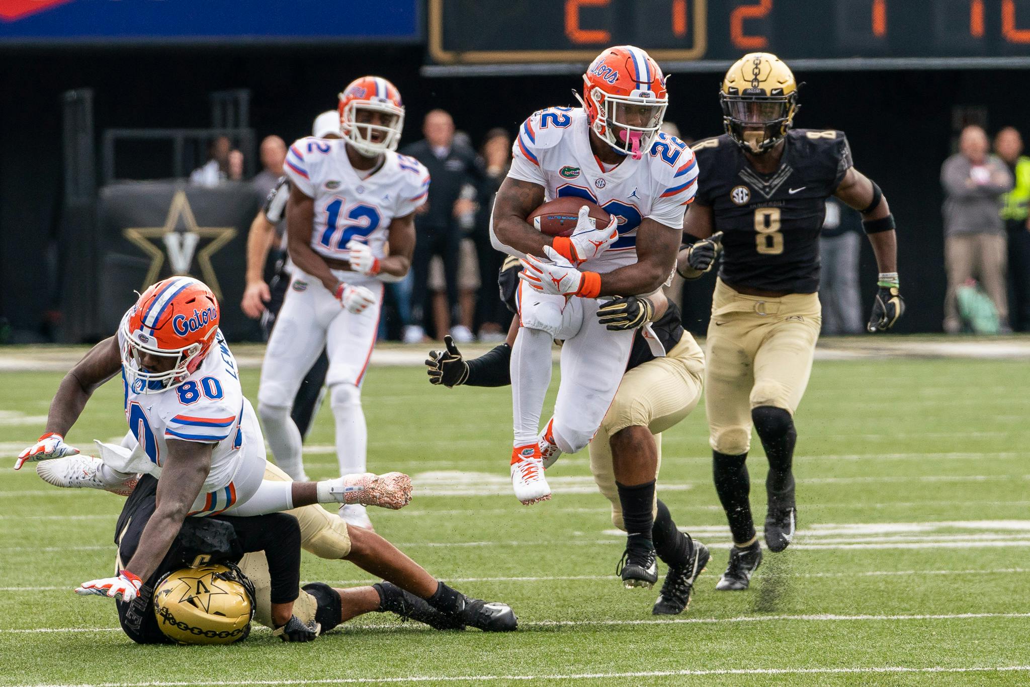 Running back Lamical Perine jumps away from a Vanderbilt defender. He compiled 215 total yards in the Gators' 37-27 victory over the Commodores. 
