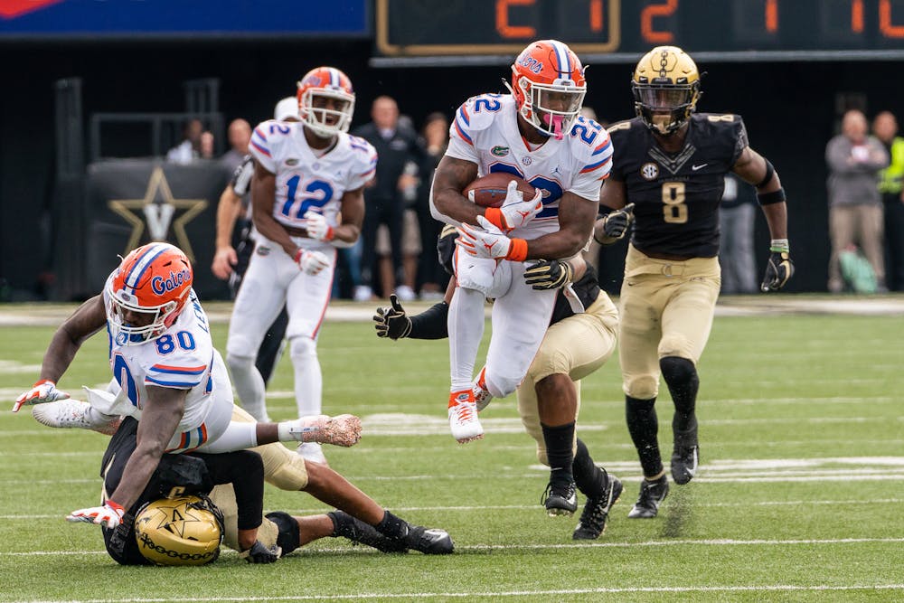 <p>Running back Lamical Perine jumps away from a Vanderbilt defender. He compiled 215 total yards in the Gators' 37-27 victory over the Commodores. </p>