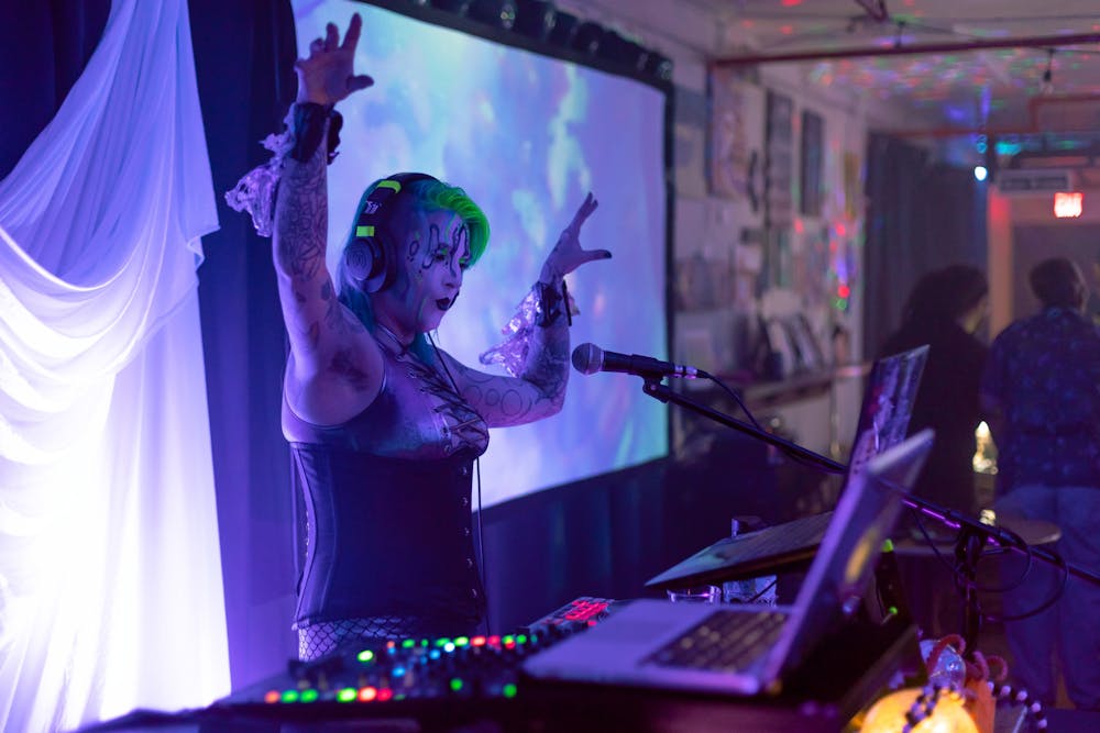 <p>Organizer and DJ Kristin Powers jams out at Saturday night’s dark aquatic dance party, held at Midnight Underground.</p>