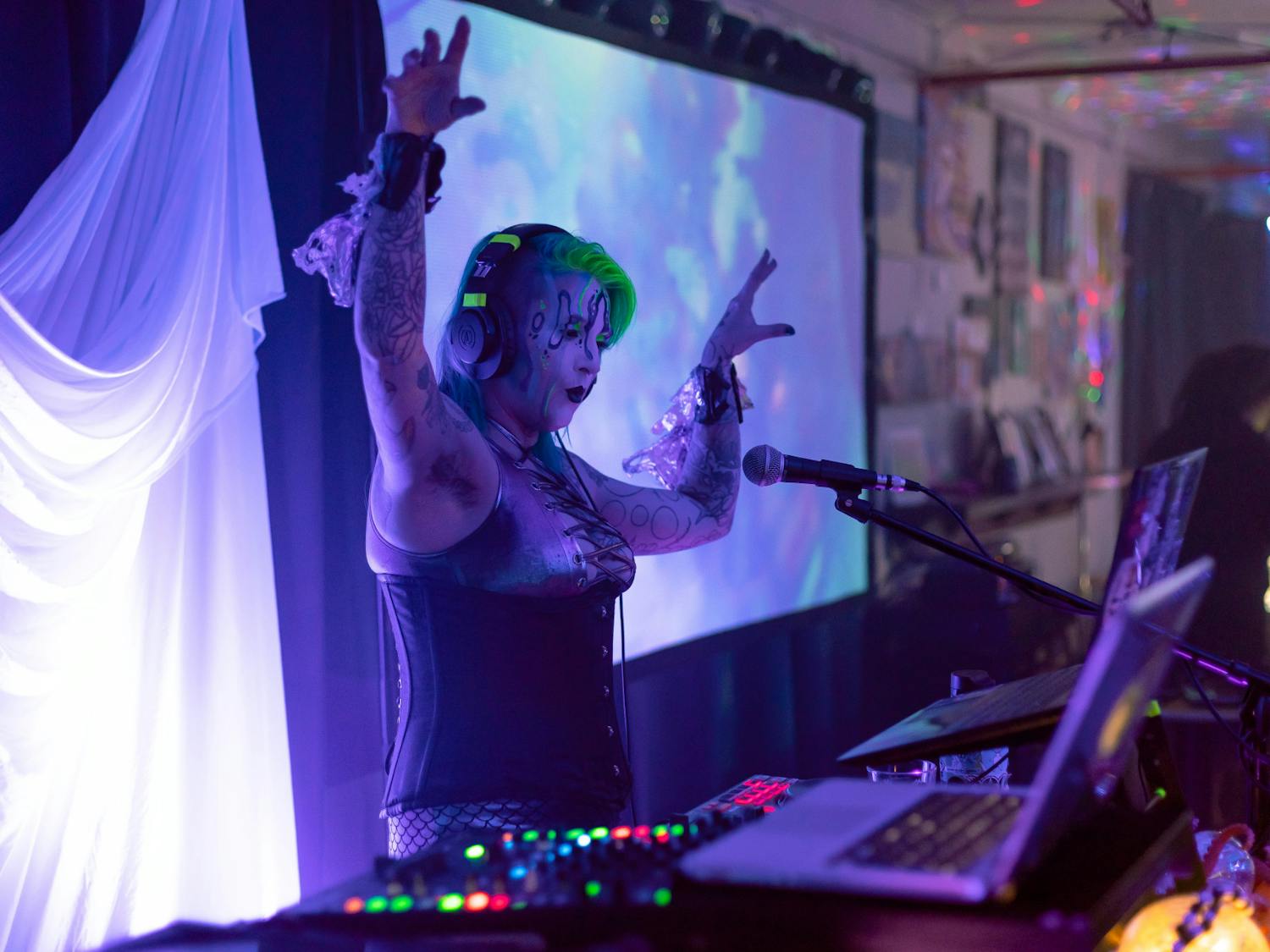 Organizer and DJ Kristin Powers jams out at Saturday night’s dark aquatic dance party, held at Midnight Underground.