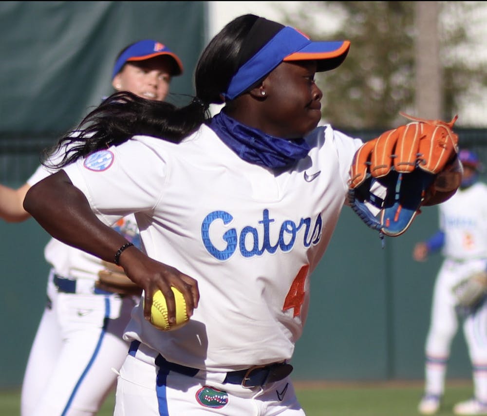 <p>Third baseman Charla Echols prepares to fire the ball towards first Mar. 3 against Florida State. </p>