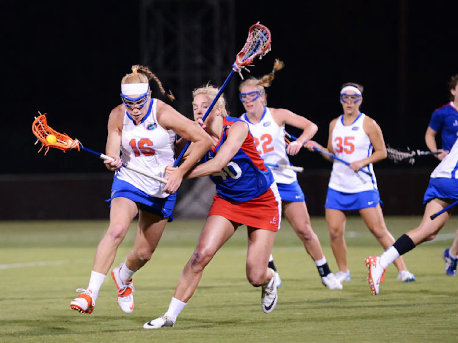 Senior midfielder Nicole Graziano (16) runs with the ball during Florida’s 18-13 exhibition win against England on Jan. 24 at Dizney Stadium. Graziano has scored two goals for the Gators in three games this season.