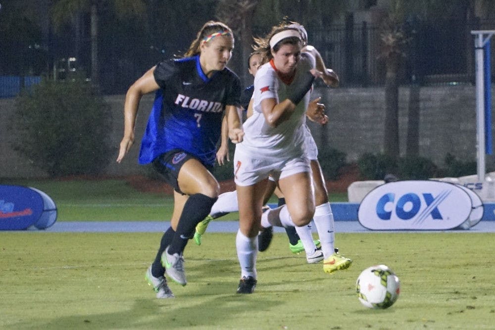 <p>UF forward Savannah Jordan chases after the ball during Florida's 3-2 win against Oklahoma State on Sept. 4, 2015, at James G. Pressly Stadium.</p>