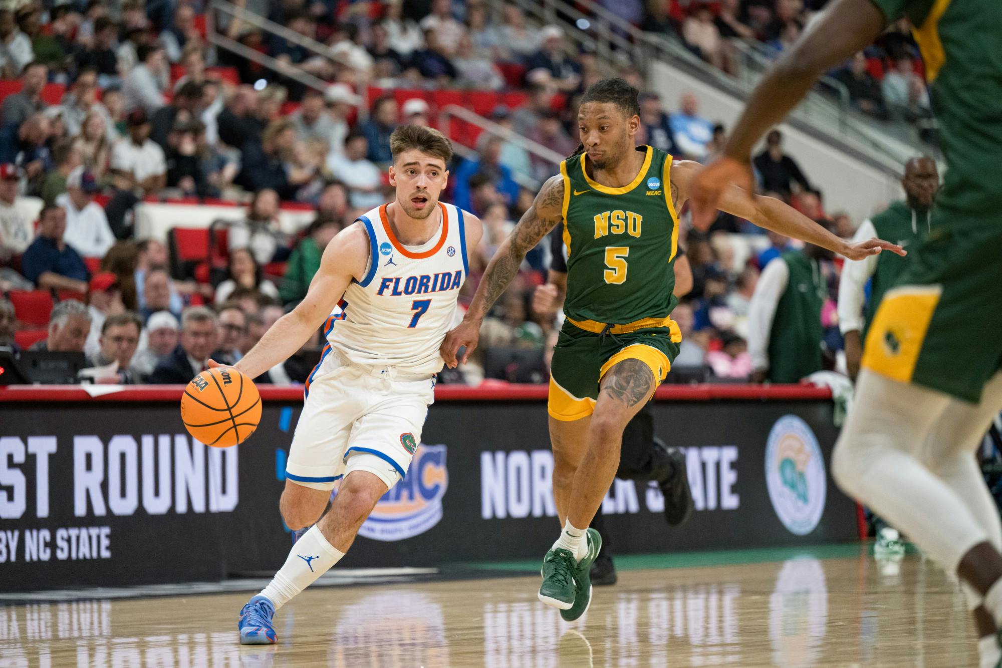 Florida Gators guard Urban Klavzar (7) drives with the ball during a basketball game against Norfolk State in the first round of the NCAA Tournament on Friday, March 21, 2025, in Raleigh, N.C.