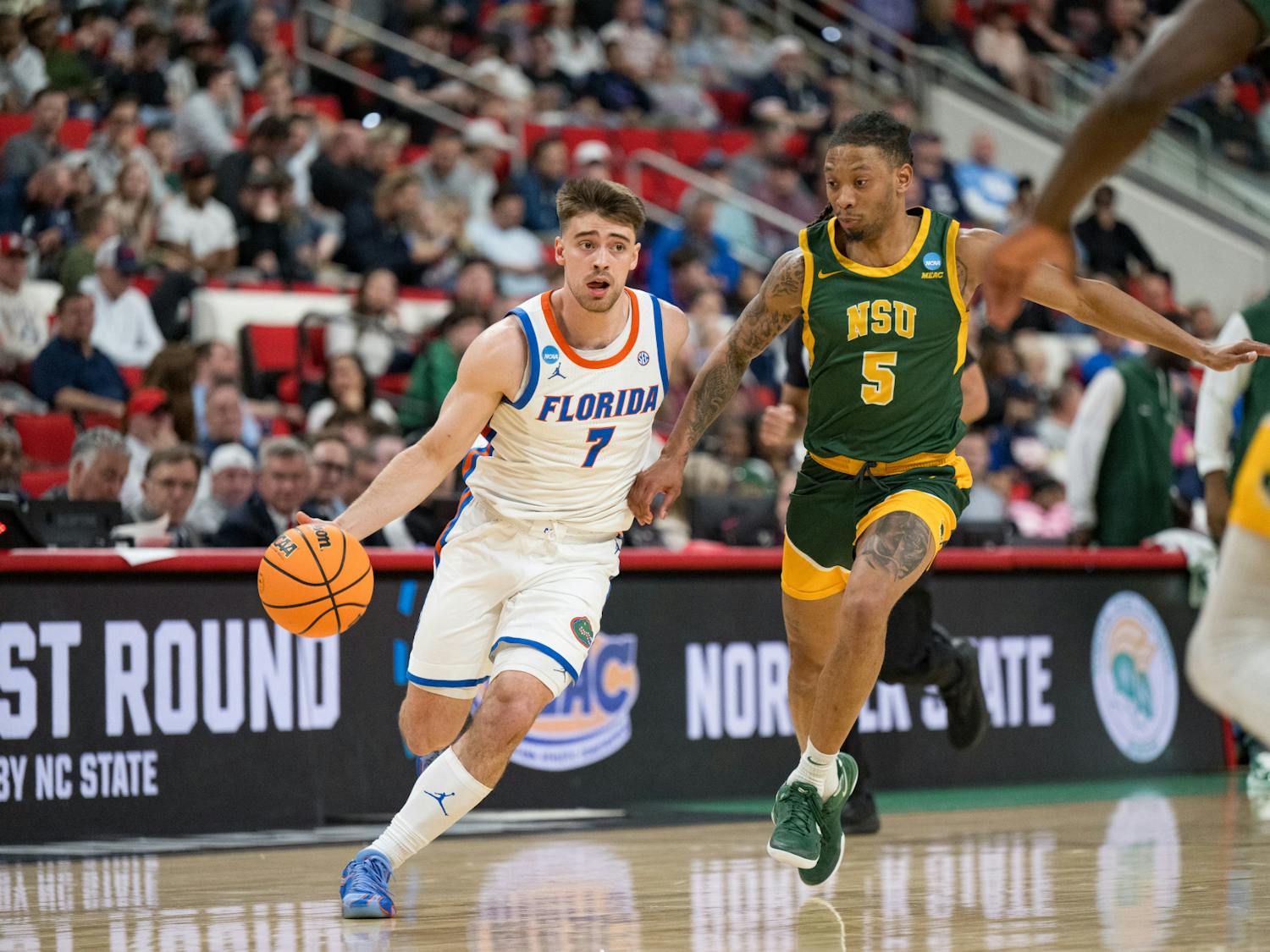 Florida Gators guard Urban Klavzar (7) drives with the ball during a basketball game against Norfolk State in the first round of the NCAA Tournament on Friday, March 21, 2025, in Raleigh, N.C.