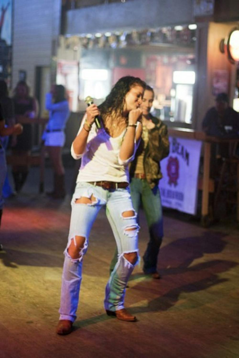 <p>Katelyn Sims, a 21-year-old sophomore at Sante Fe College who has cystic fibrosis, teaches line dancing at :08 on Friday night.</p>