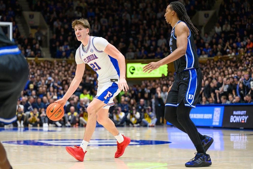 Florida forward Alex Condon (21) dribbles during the second half of an NCAA college basketball game against Duke, Tuesday, Dec. 2, 2025, at Cameron Indoor Stadium in Durham, NC.