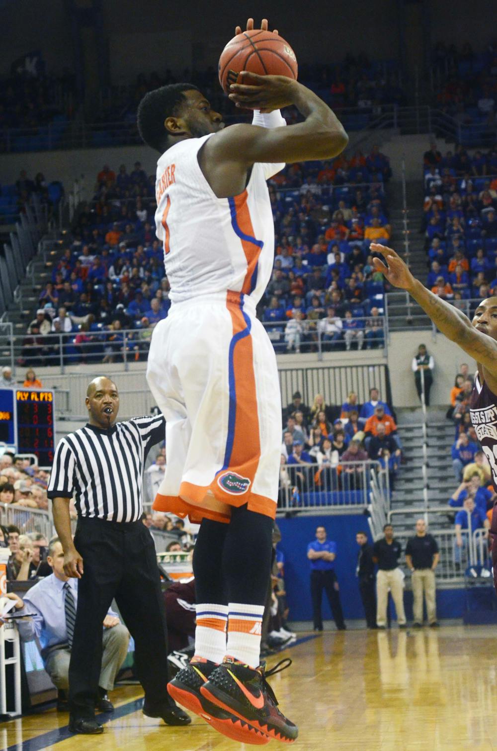 <p>Eli Carter attempts a three-point shot during Florida's 72-47 win against Mississippi State on Saturday in the O'Connell Center.</p>