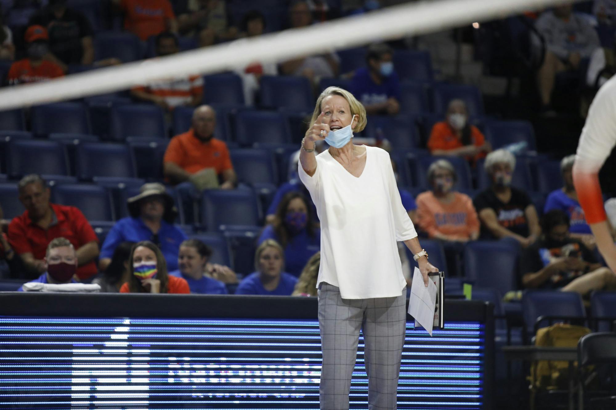 Florida head coach Mary Wise communicates with her players during a game against Mississippi State on Sept. 24.