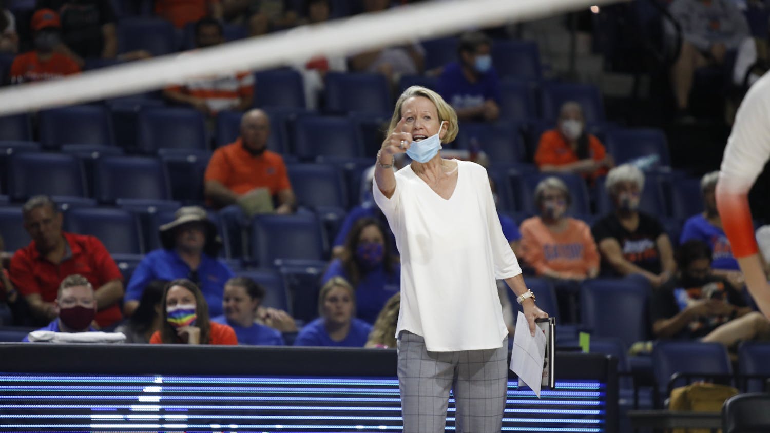 Florida head coach Mary Wise communicates with her players during a game against Mississippi State on Sept. 24.
