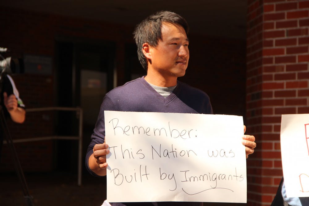 <p><span id="docs-internal-guid-8673c78e-4a60-2013-fef1-290620f9bcc2"><span>Sangdon So, a visiting scholar for UF's College of Engineering who is originally from South Korea, protests in support of immigrants. He said he would like to get a green card and live with his family in the U.S., but he is uncertain that this will be a possibility for him.</span></span></p>