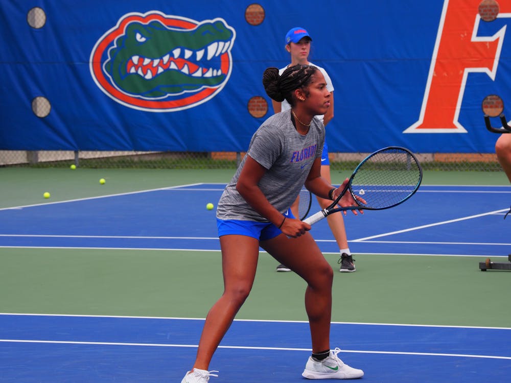 Freshman Qavia Lopez prepares to hit the ball during a Gators women's tennis practice. 