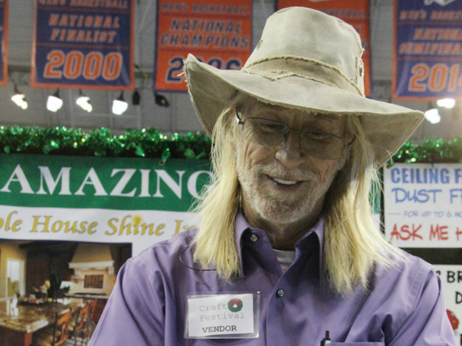 Darrell "Chi" Chichester, 58, shines his wedding ring with Aunt Lisa's Amazing Stuff at the 2015 Craft Festival. The "shine in a bottle" says it also cleans ceiling fans and stainless steel.
