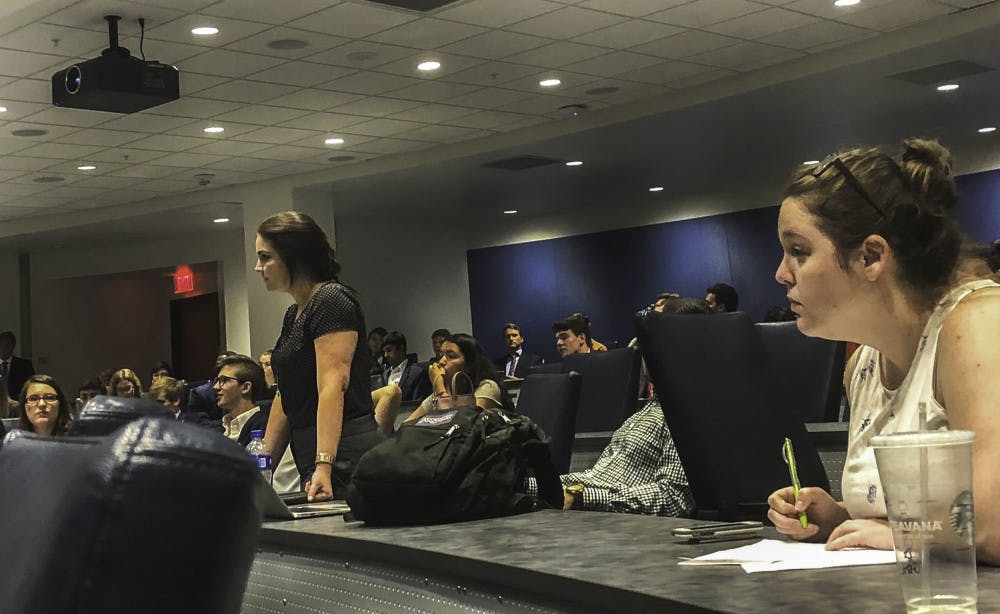 <p>Ashley Grabowski (left) at a May 25 Student Senate meeting. </p>