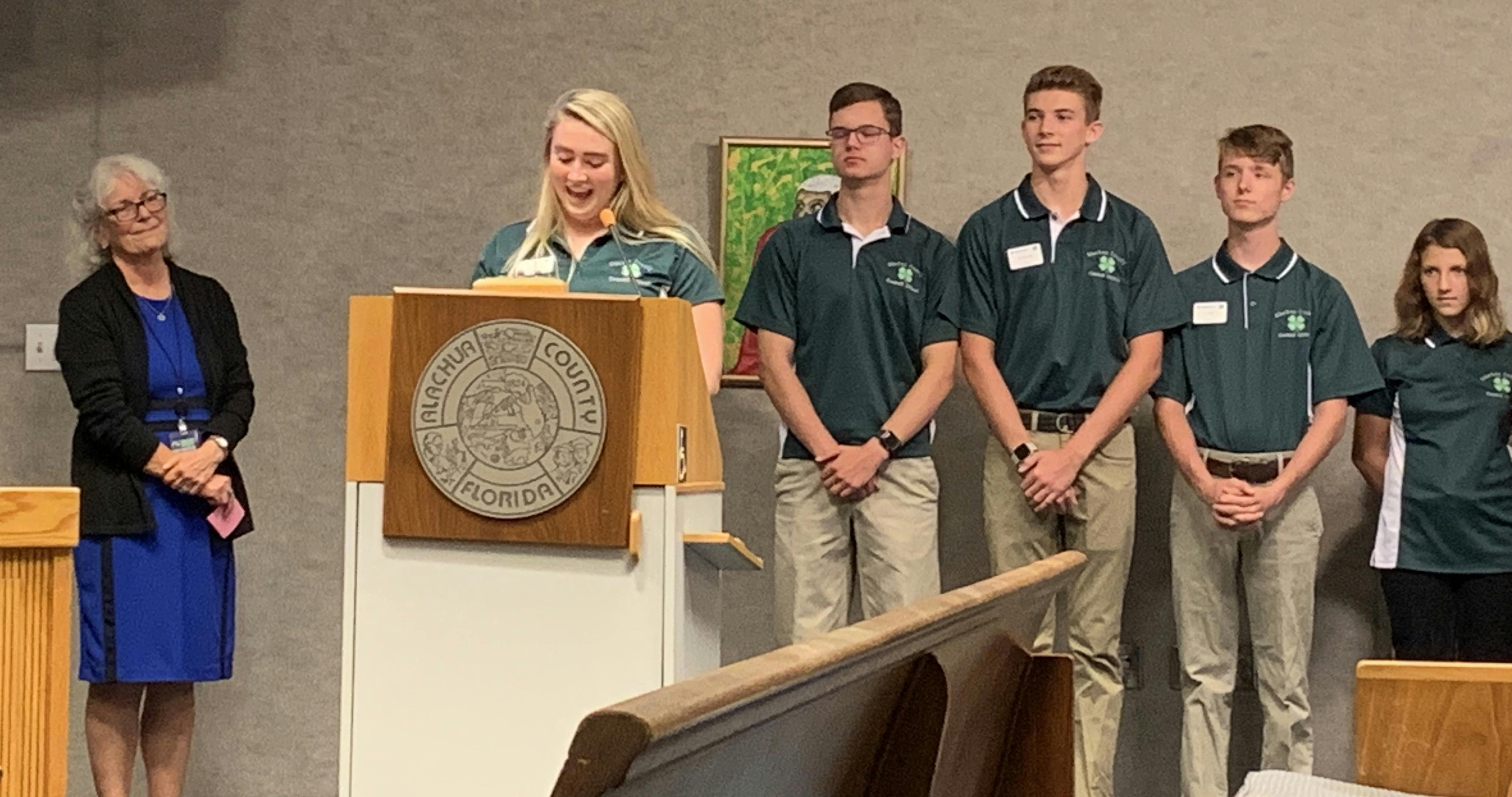 Alachua County 4-H President Madison Hurm, 17, speaks at Tuesday’s County Commission meeting. The board proclaimed Oct. 6 through Oct. 12 as National 4-H Week in Alachua County. 