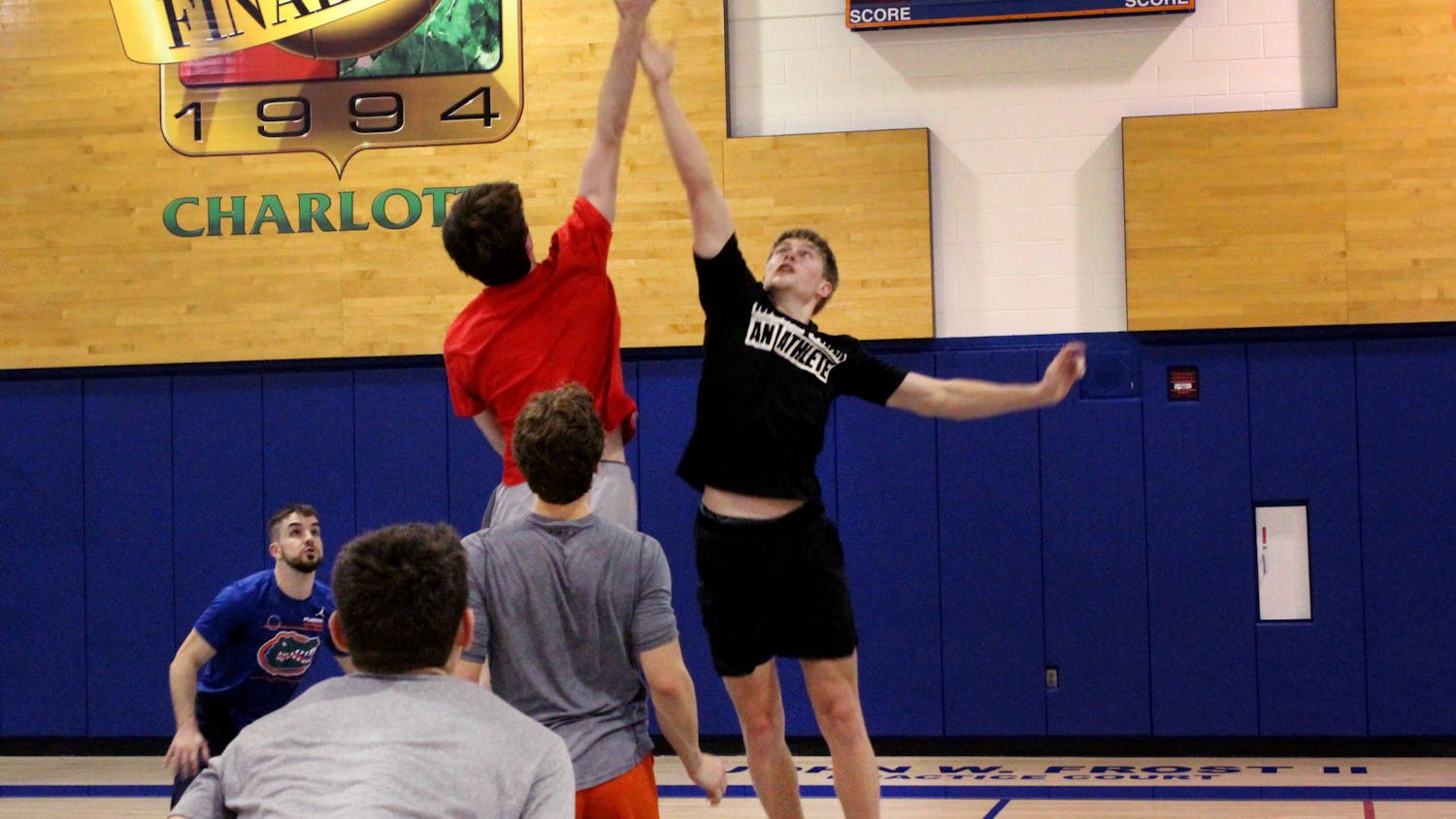 UF basketball manager Bennett Andersen leaps for the jump ball against UGA's managers on Thursday, Feb. 10 at the Florida Basketball Practice Complex. 