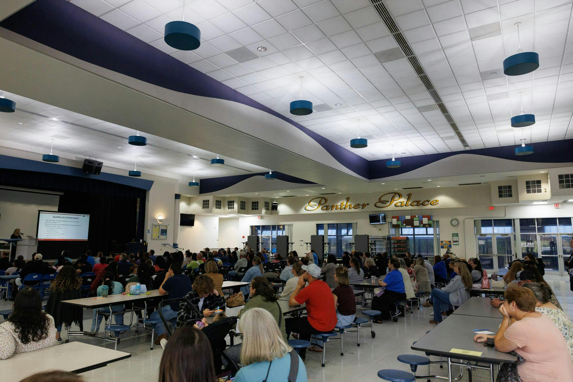 Community members listen during a meeting at Oak View Middle School reguarding the school's transition to a K-8 school, Tuesday, April 7, 2026.