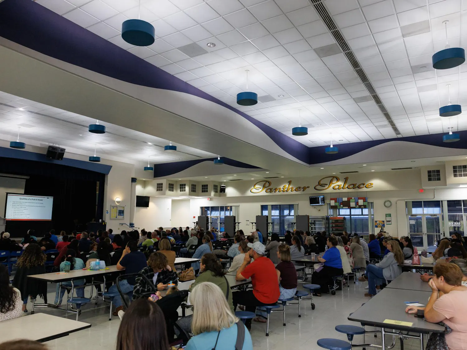 Community members listen during a meeting at Oak View Middle School reguarding the school's transition to a K-8 school, Tuesday, April 7, 2026.