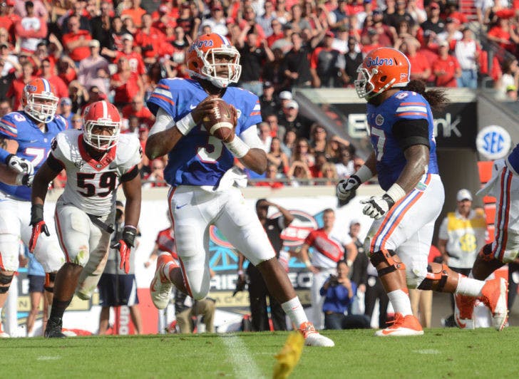 Quarterback Tyler Murphy attempts a pass during Florida’s 23-20 loss to Georgia on Nov. 2 at EverBank Field in Jacksonville. UF announced Sunday that Murphy will transfer from Florida and play his final season of eligibility elsewhere.