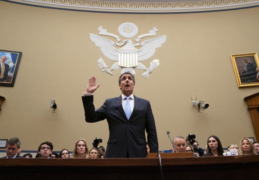 Michael Cohen, President Donald Trump's former personal lawyer, is sworn in to testify before the House Oversight and Reform Committee on Capitol Hill in Washington, Wednesday, Feb. 27, 2019. (AP Photo/J. Scott Applewhite)