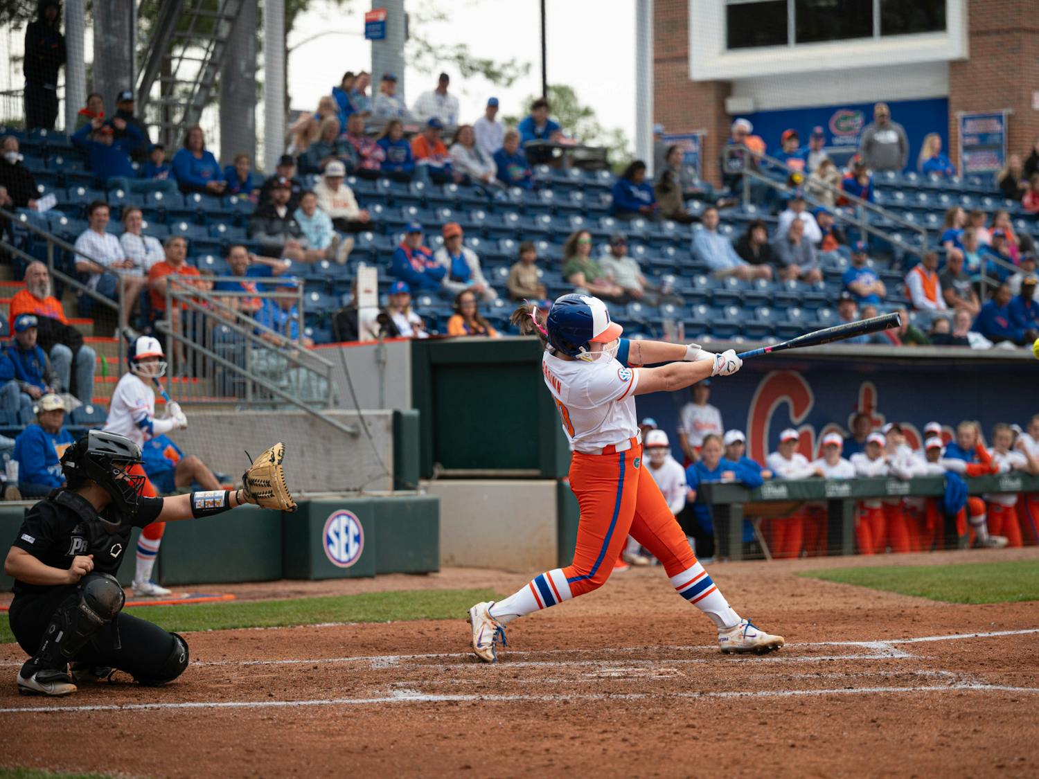 Florida Gators pitcher/first baseman Ava Brown (00) swings in a softball game against Providence in Gainesville, Fla., on Friday, Feb. 14, 2025.