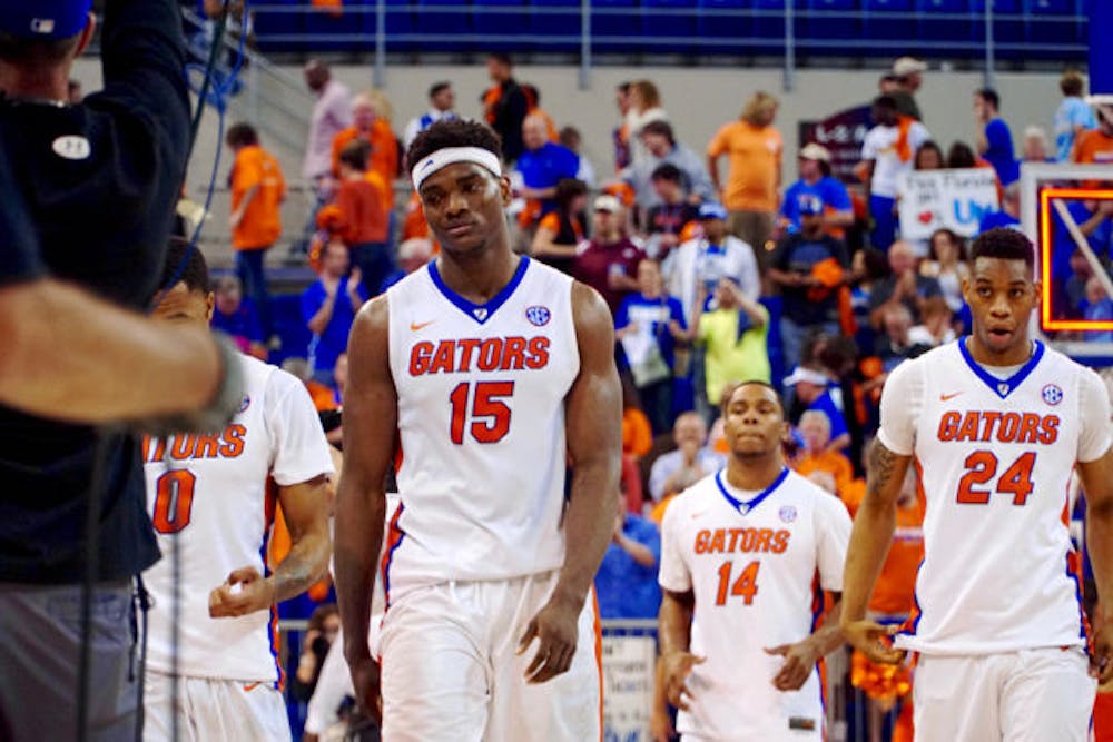 <p>UF's John Egbunu (15), Lexx Edwards (14) and Justin Leon (24) walk off the court following Florida's 88-79 loss to Kentucky on March 1, 2016, in the O'Connell Center.</p>