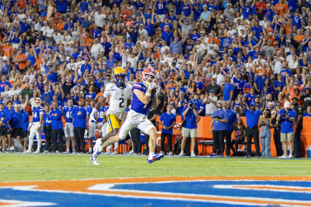 Senior wide receiver Ricky Pearsall catches a pass for a touchdown in the Gators' 49-7 win against the McNeese State Cowboys Saturday, Sept. 9, 2023. 