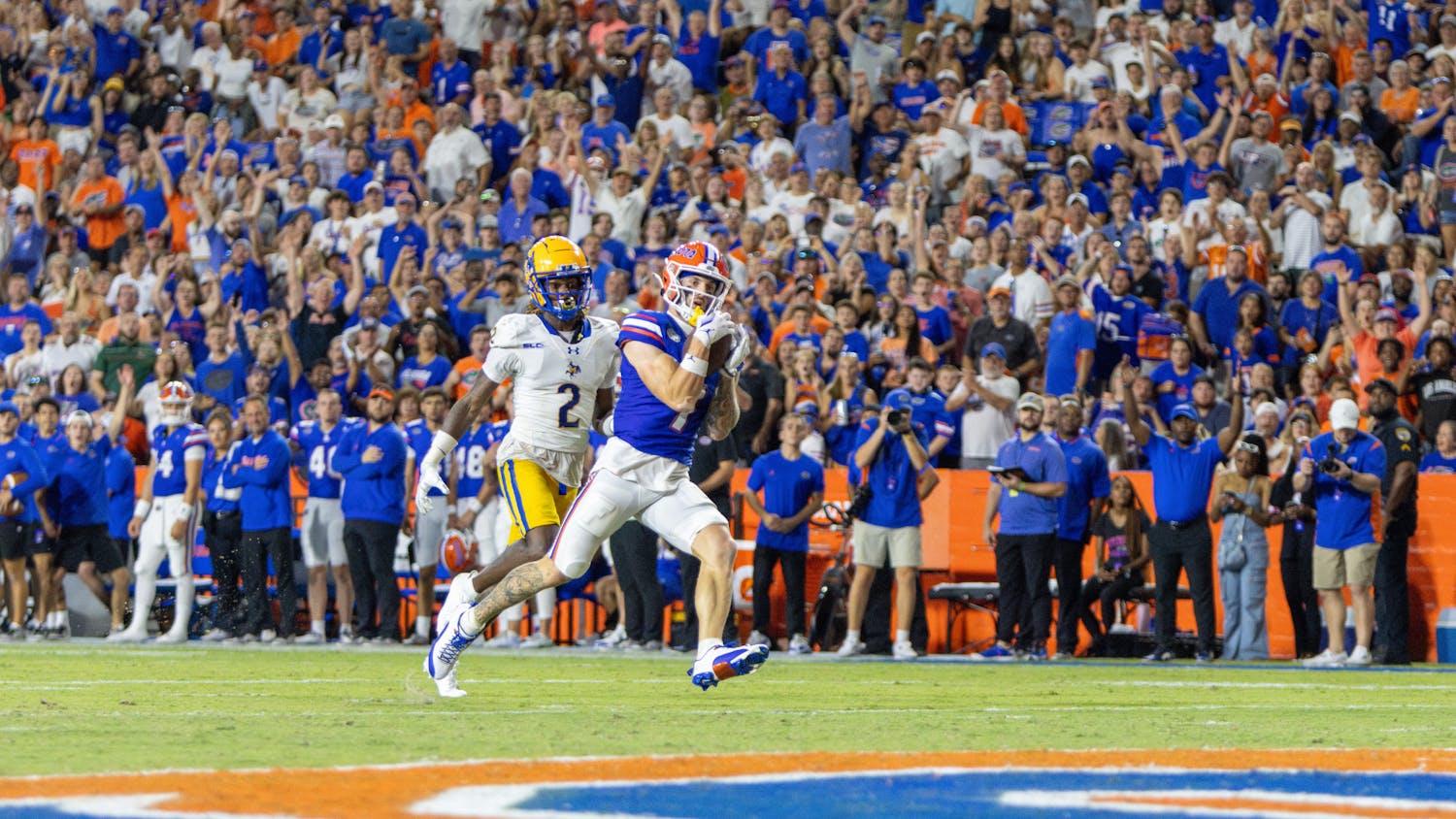 Senior wide receiver Ricky Pearsall catches a pass for a touchdown in the Gators' 49-7 win against the McNeese State Cowboys Saturday, Sept. 9, 2023. 