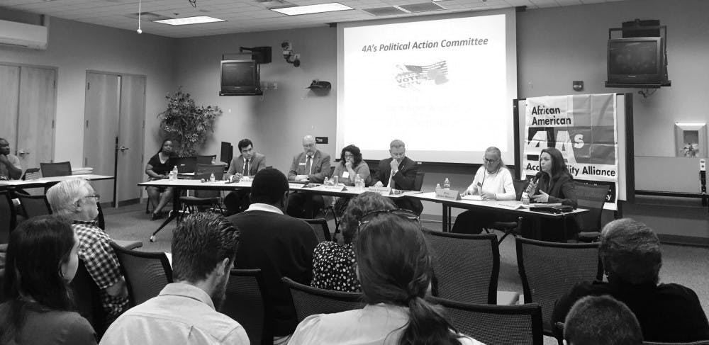 About 50 community members listened to six City Commission candidates at a forum on Monday night.