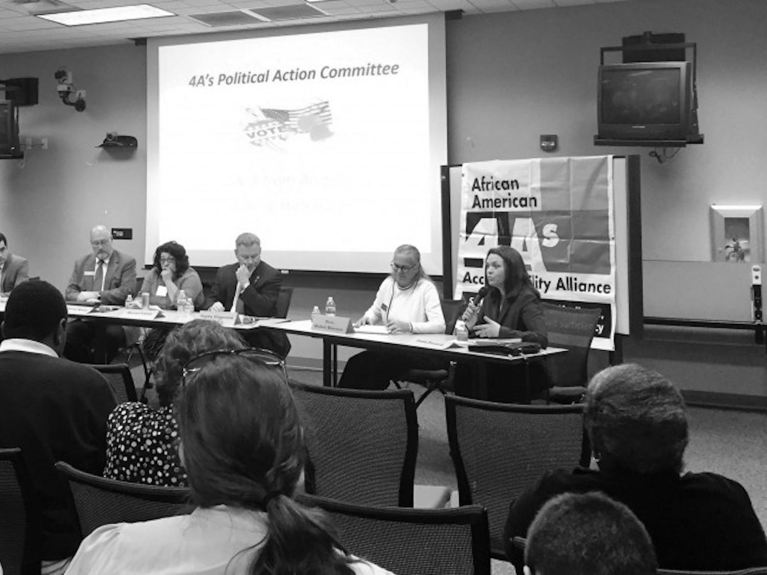 About 50 community members listened to six City Commission candidates at a forum on Monday night.