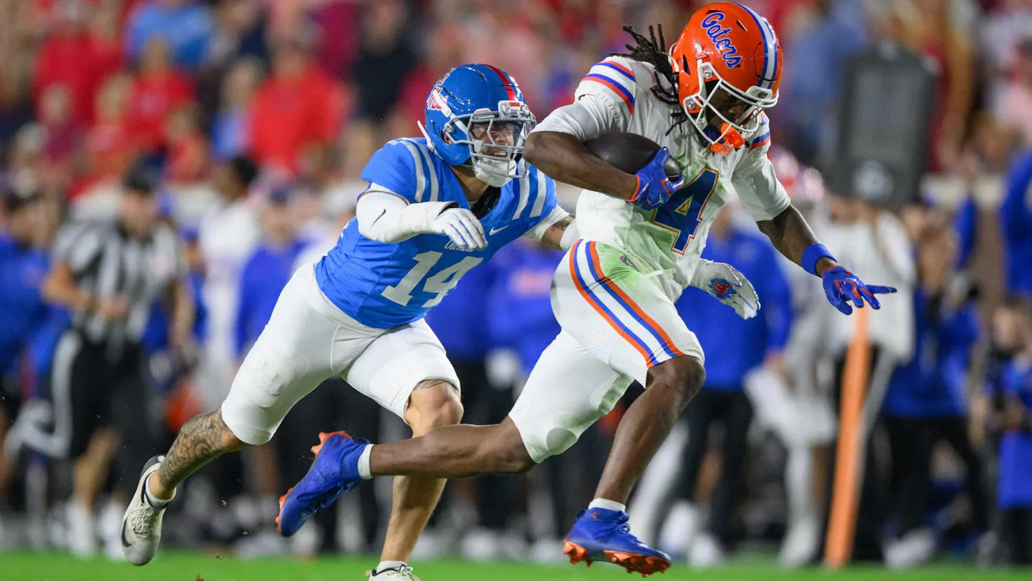 Florida wide receiver TJ Abrams (4) runs with the ball during an NCAA college football game, Saturday, Nov. 15, 2025, in Oxford, Miss.
